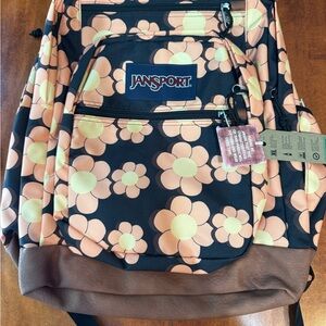 JanSport Black Backpack with Orange and Cream Floral Pattern